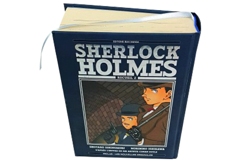 Un livre de bande dessinée de luxe à couverture rigide, épaisse avec une marque-page et une tranchefile.